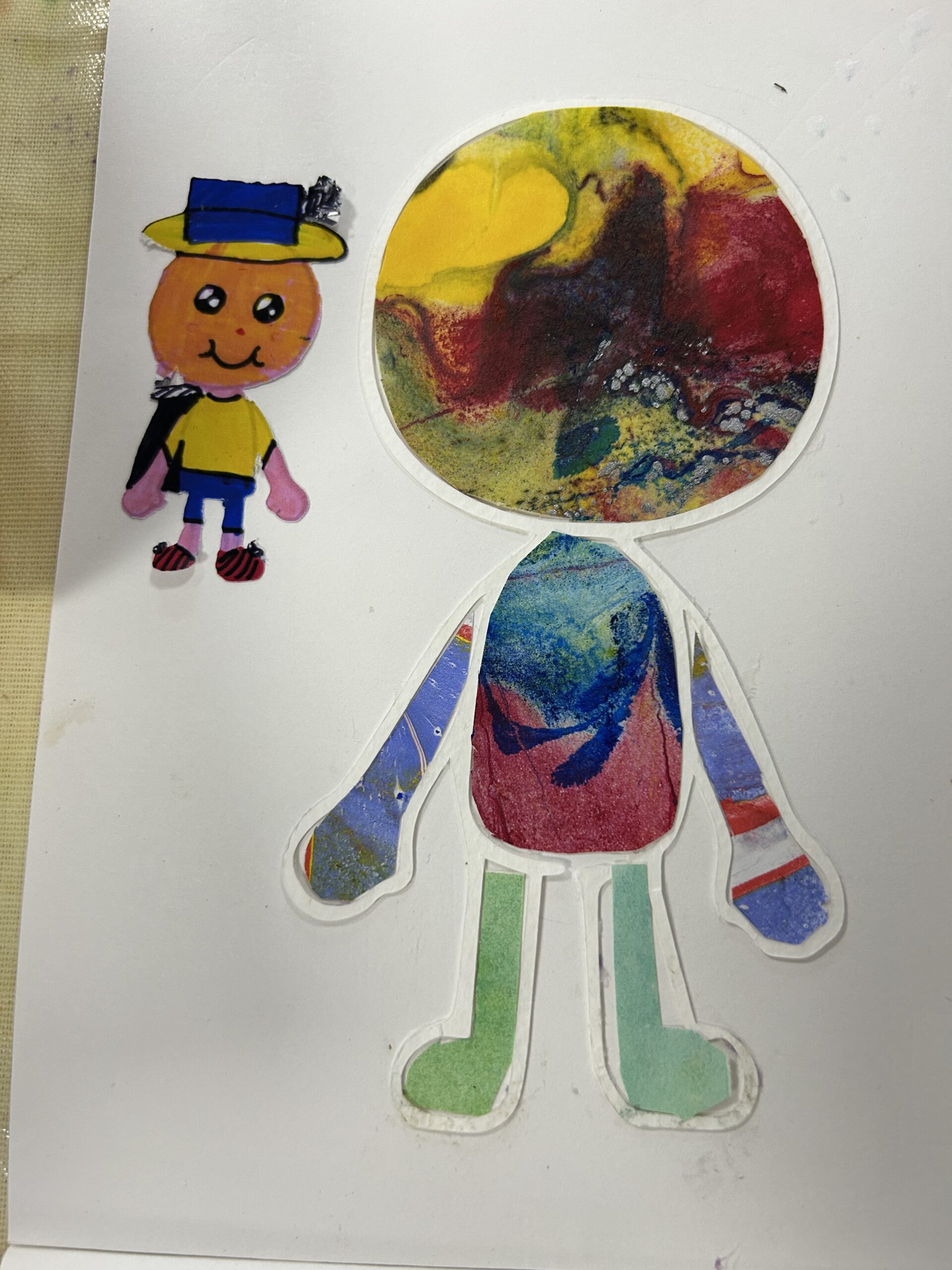 Collage of a humanoid character using marbled papers.